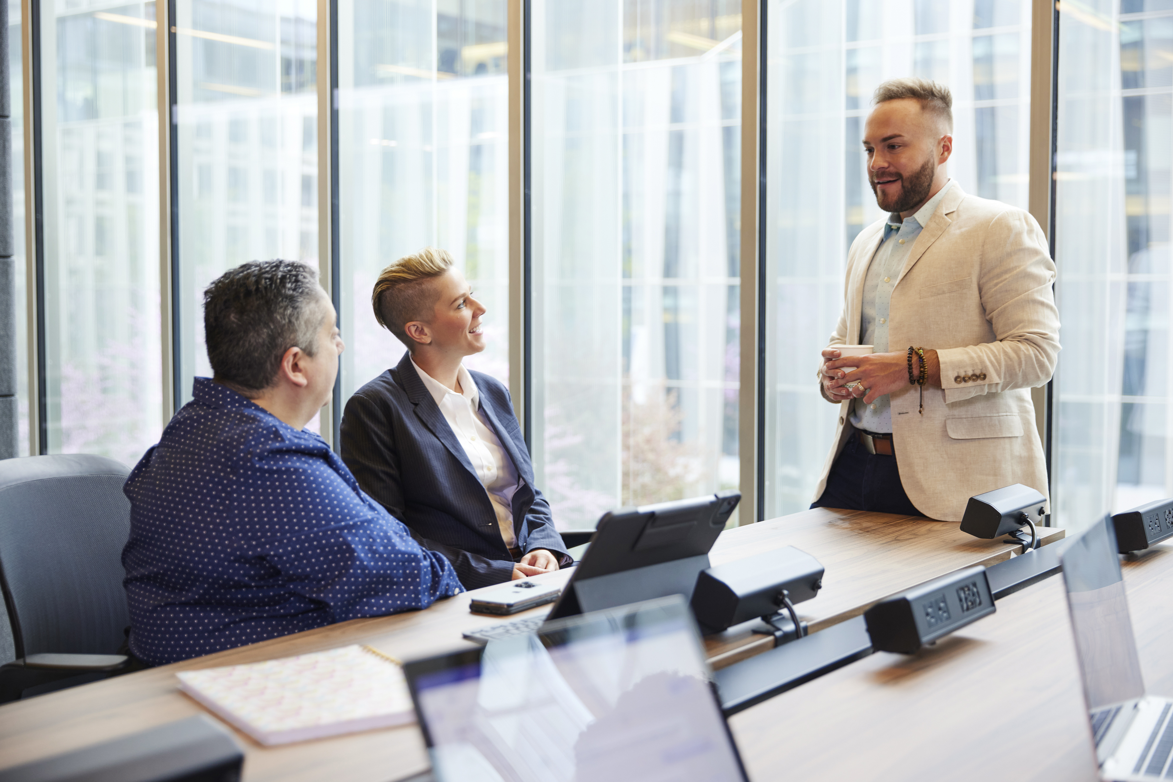 Image of 3 colleagues in a meeting.